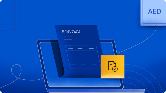 A UAE-based e-invoice is displayed in front of a laptop.